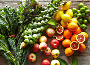 a group of fruits and vegetables on a wood surface Healthy Weight Loss Diets Edinburgh